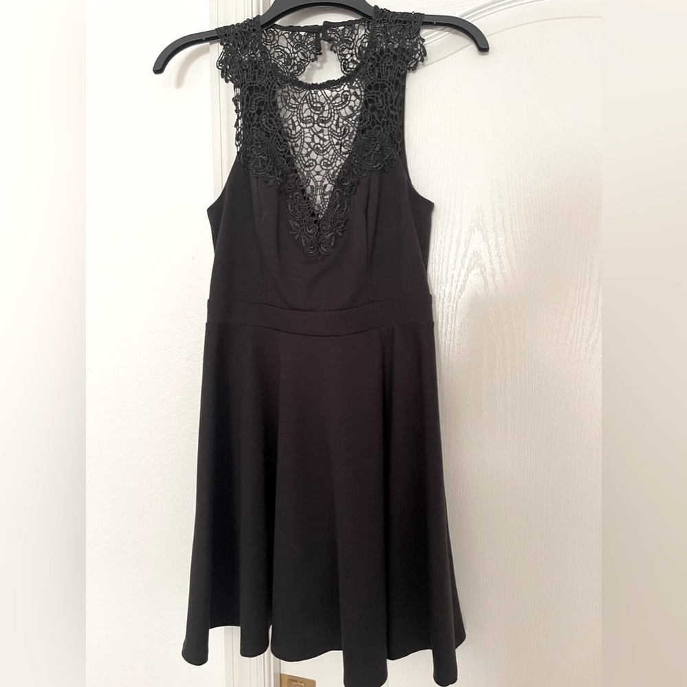 Little black dress. Cocktail dress. Lace accent.